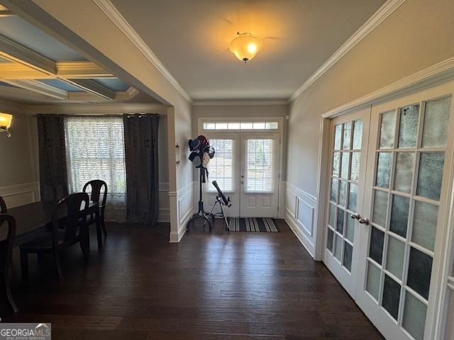 5530 Lacebark Pine Ct, Cumming, GA 30040 - foyer featuring french doors, dark wood-style flooring, crown molding, a decorative wall, and a wainscoted wall