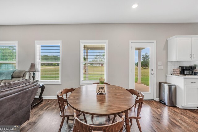 dining room with recessed lighting, dark wood-style flooring, and a wealth of natural light