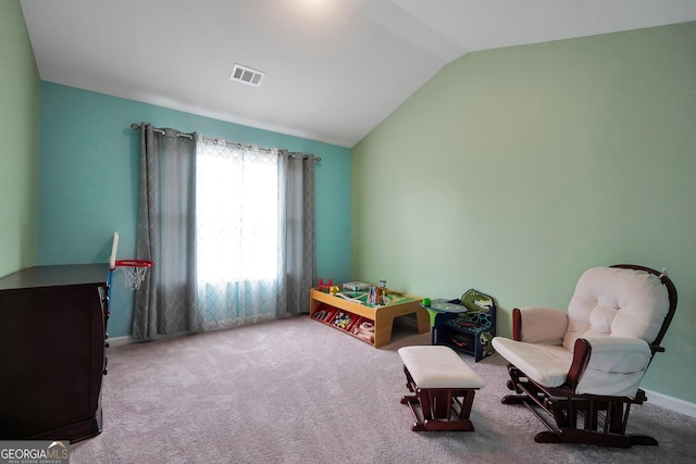 interior space featuring visible vents, baseboards, carpet, and lofted ceiling