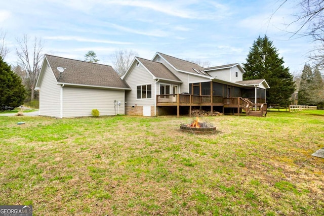 765 River Oaks Dr, Hayesville, NC 28904 - rear view of property featuring an outdoor fire pit, a sunroom, a deck, and a lawn