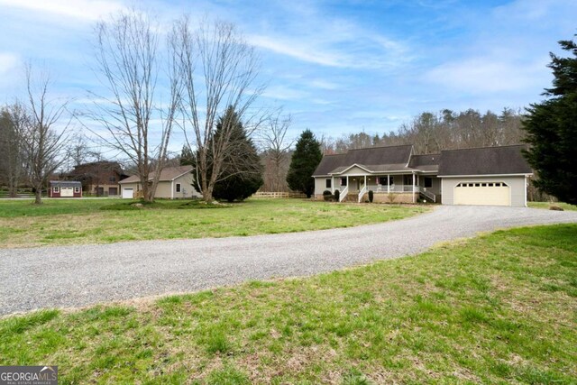 765 River Oaks Dr, Hayesville, NC 28904 - ranch-style house featuring a porch, driveway, a front lawn, and an attached garage