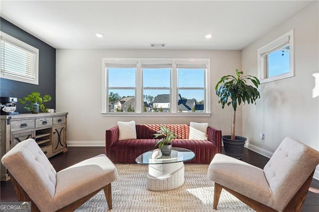 living room with recessed lighting, wood finished floors, and baseboards