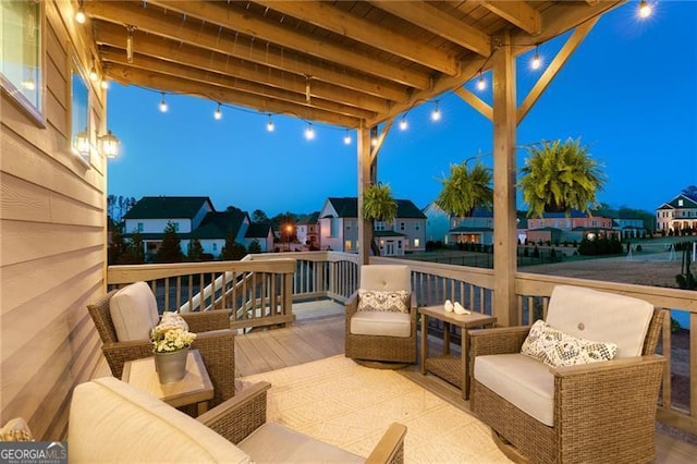 view of patio featuring an outdoor living space, a residential view, and a deck