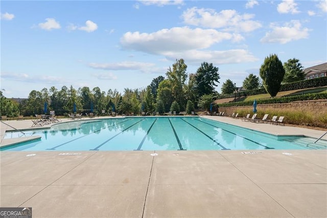 pool with a patio area