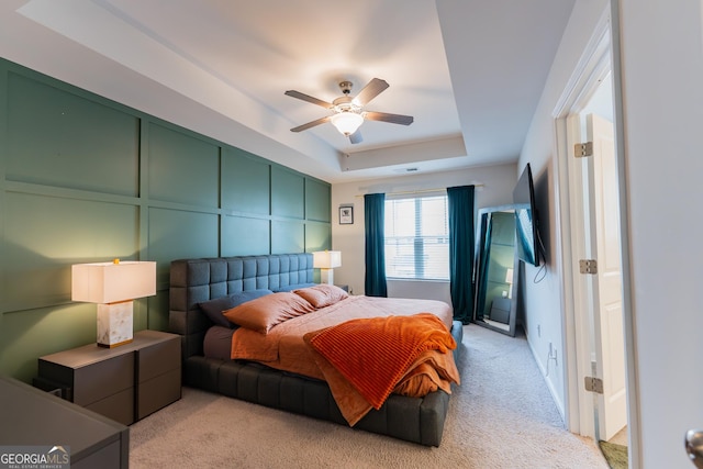 3132 Meadowstone Ln SW, Atlanta, GA 30331 - bedroom featuring light carpet, a raised ceiling, and ceiling fan