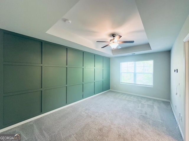 3132 Meadowstone Ln SW, Atlanta, GA 30331 - unfurnished bedroom with a tray ceiling, carpet, and a ceiling fan