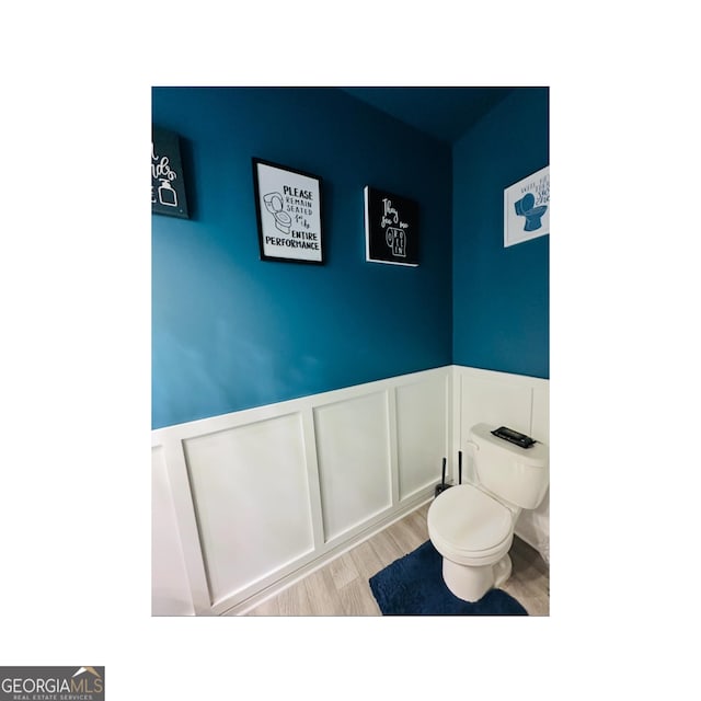 3132 Meadowstone Ln SW, Atlanta, GA 30331 - bathroom with a wainscoted wall, wood finished floors, and a decorative wall