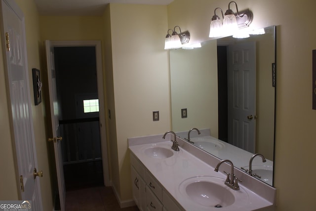 bathroom featuring double vanity and a sink
