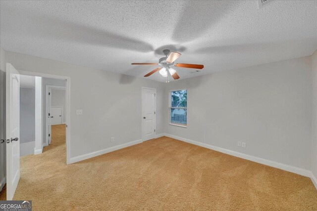 139 Forestbrooke Way, Bonaire, GA 31005 - unfurnished room featuring carpet floors, baseboards, a ceiling fan, and a textured ceiling