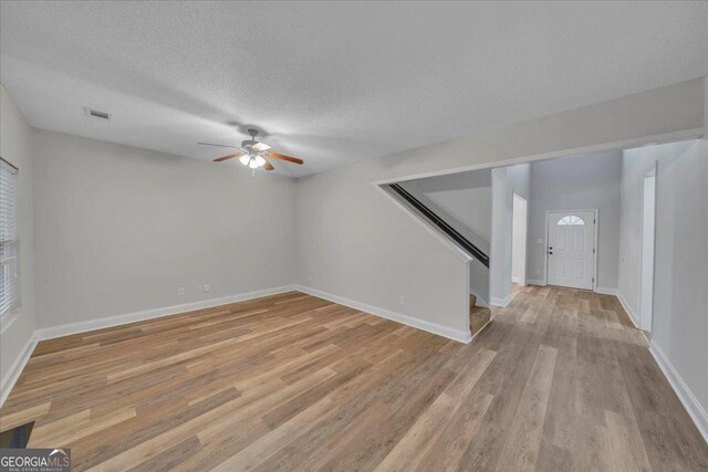 139 Forestbrooke Way, Bonaire, GA 31005 - spare room with light colored carpet, ceiling fan, a textured ceiling, and baseboards