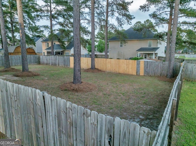 view of yard with a fenced backyard