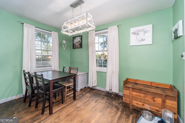 403 Spurgeon St, Waycross, GA 31501 - dining area featuring baseboards, a wealth of natural light, and wood-type flooring