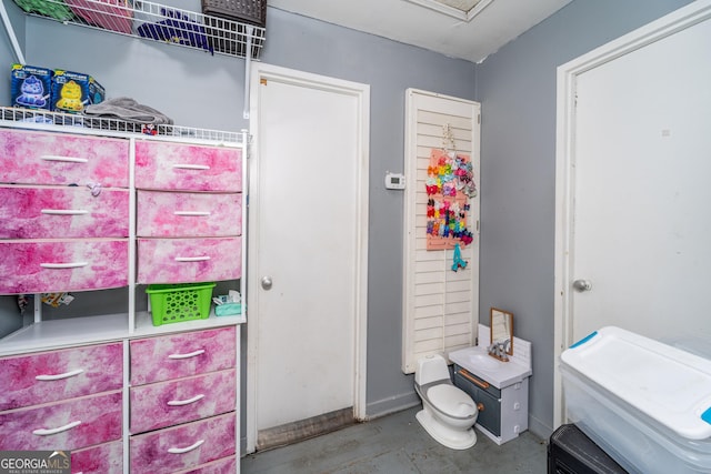 403 Spurgeon St, Waycross, GA 31501 - bathroom with baseboards and toilet