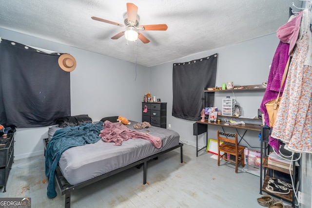 403 Spurgeon St, Waycross, GA 31501 - bedroom with a ceiling fan, concrete floors, baseboards, and a textured ceiling