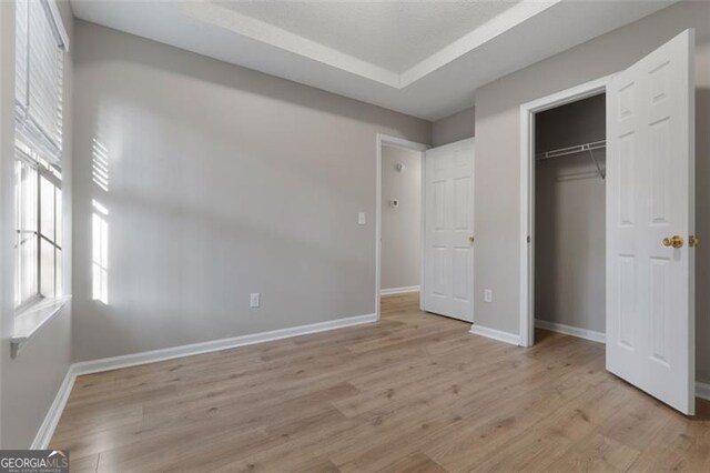 4625 Thermal Ct, Douglasville, GA 30135 - unfurnished bedroom featuring light wood-style floors, baseboards, and a closet