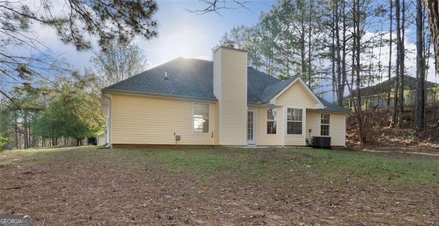 4625 Thermal Ct, Douglasville, GA 30135 - back of house with a shingled roof, central AC, and a chimney