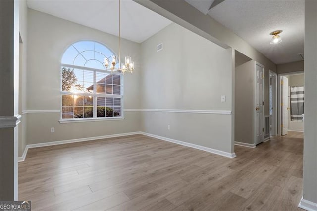 4625 Thermal Ct, Douglasville, GA 30135 - unfurnished dining area with plenty of natural light, baseboards, wood finished floors, and a chandelier