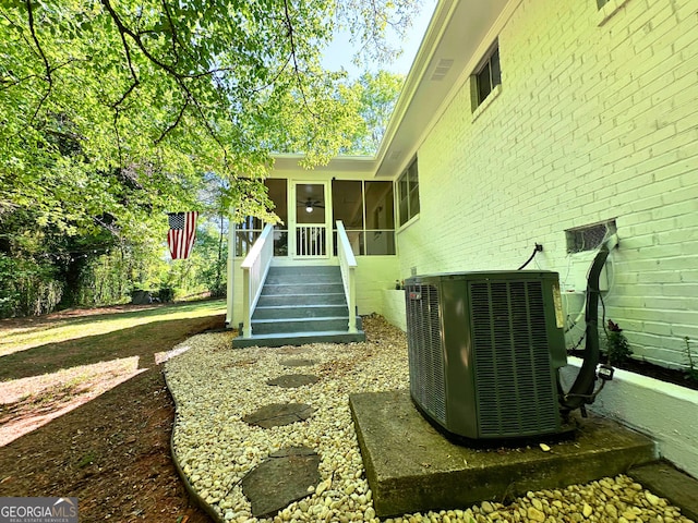 entrance to property featuring central AC
