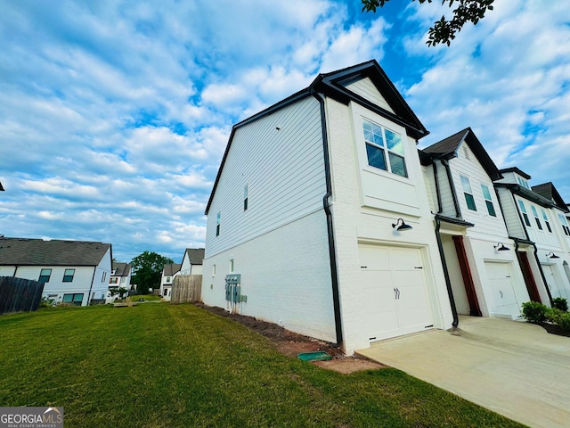124 Auburn Run Ln, Auburn, GA 30011 - view of home's exterior featuring brick siding, an attached garage, a residential view, and driveway