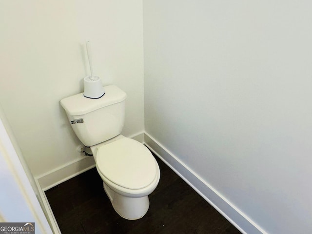 124 Auburn Run Ln, Auburn, GA 30011 - bathroom with baseboards, toilet, and wood finished floors