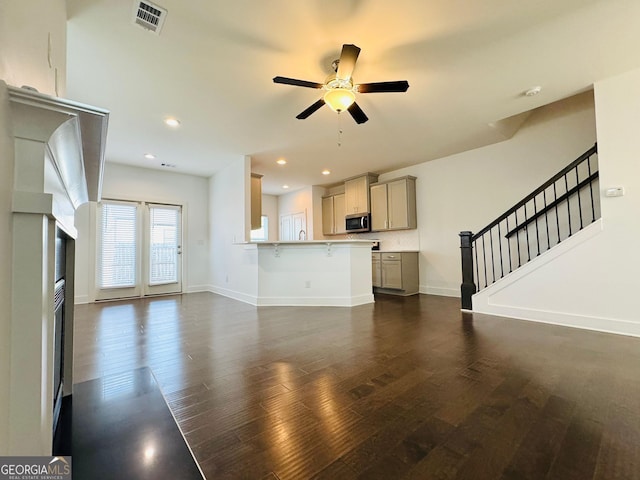 124 Auburn Run Ln, Auburn, GA 30011 - unfurnished living room with dark wood finished floors, ceiling fan, baseboards, and recessed lighting