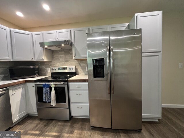 411 Woodland Dr, Hinesville, GA 31313 - kitchen with tasteful backsplash, appliances with stainless steel finishes, under cabinet range hood, white cabinetry, and dark wood-type flooring
