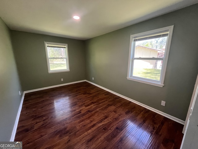 411 Woodland Dr, Hinesville, GA 31313 - unfurnished room with dark wood-type flooring, baseboards, and recessed lighting