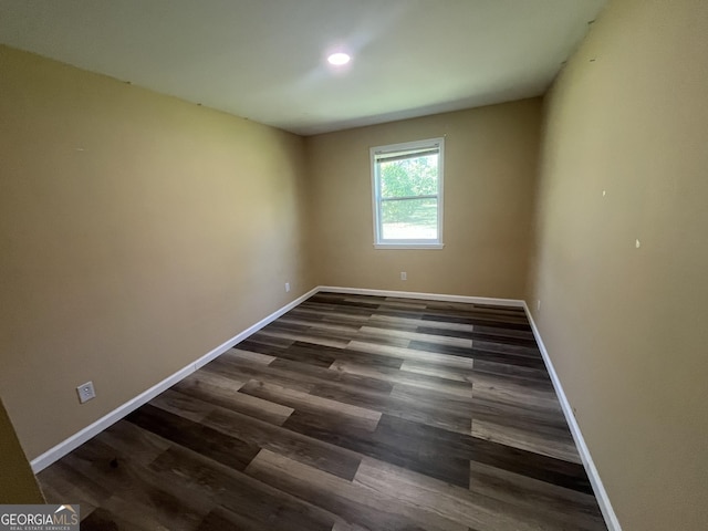 411 Woodland Dr, Hinesville, GA 31313 - empty room featuring baseboards and wood finished floors