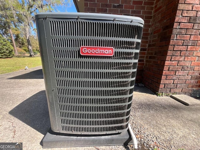 411 Woodland Dr, Hinesville, GA 31313 - exterior details featuring central AC unit and brick siding