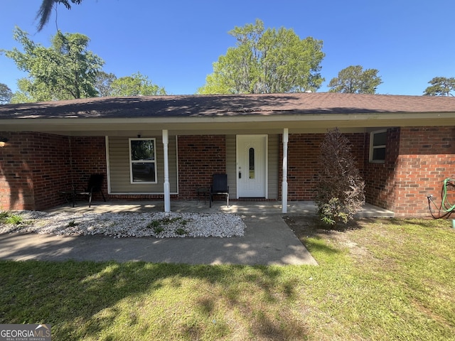 411 Woodland Dr, Hinesville, GA 31313 - exterior space with a front yard and brick siding