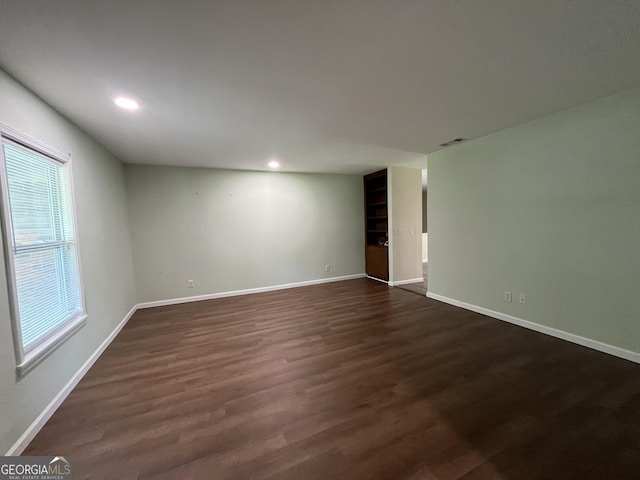 411 Woodland Dr, Hinesville, GA 31313 - unfurnished room with dark wood-type flooring, baseboards, and recessed lighting