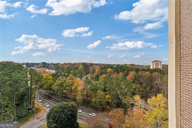 exterior space with a wooded view
