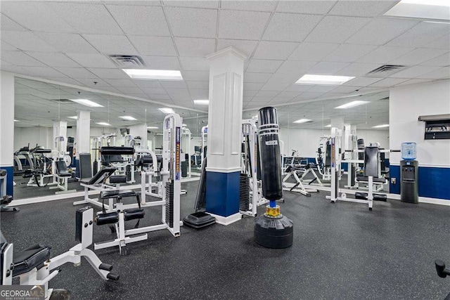 workout area featuring a drop ceiling and visible vents