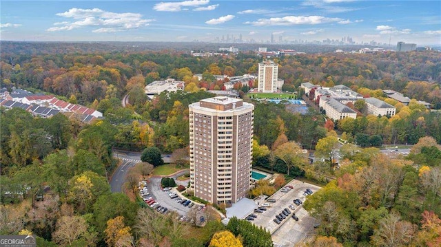 birds eye view of property with a view of city