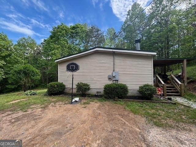 view of side of property featuring crawl space