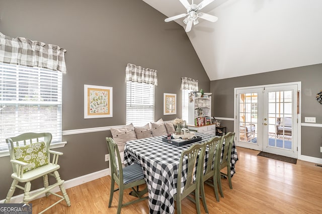 37 Covered Springs Dr NE, Rome, GA 30165 - dining area with high vaulted ceiling, light wood finished floors, baseboards, ceiling fan, and french doors