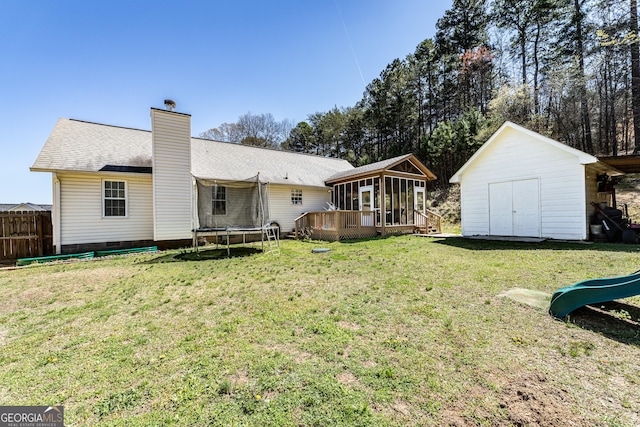 37 Covered Springs Dr NE, Rome, GA 30165 - rear view of house featuring roof with shingles, a trampoline, a chimney, an outbuilding, and a storage unit