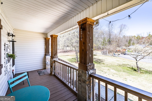 37 Covered Springs Dr NE, Rome, GA 30165 - wooden deck featuring covered porch