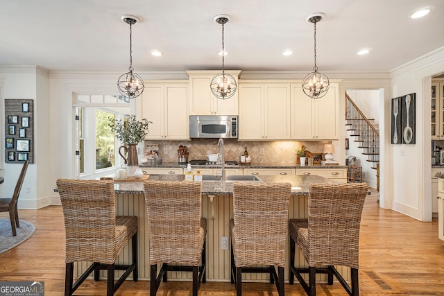 3227 Aviary Ct NW, Acworth, GA 30101 - kitchen with stainless steel microwave, dark stone counters, tasteful backsplash, baseboards, and pendant lighting