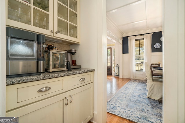 3227 Aviary Ct NW, Acworth, GA 30101 - bar with light wood-style floors, ornamental molding, wainscoting, a decorative wall, and decorative backsplash