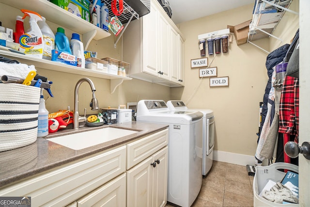3227 Aviary Ct NW, Acworth, GA 30101 - washroom featuring washing machine and clothes dryer, cabinet space, light tile patterned floors, and baseboards