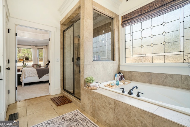 3227 Aviary Ct NW, Acworth, GA 30101 - bathroom with a bath, ensuite bath, a stall shower, and tile patterned floors