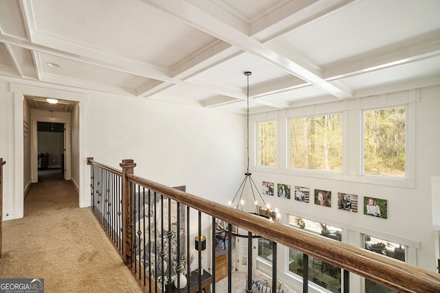 3227 Aviary Ct NW, Acworth, GA 30101 - hallway featuring coffered ceiling, beamed ceiling, light colored carpet, an upstairs landing, and a chandelier