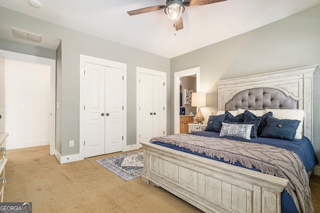 3227 Aviary Ct NW, Acworth, GA 30101 - bedroom with multiple closets, light colored carpet, baseboards, and ceiling fan