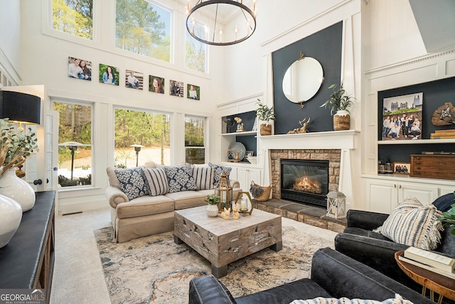 3227 Aviary Ct NW, Acworth, GA 30101 - carpeted living room with a high ceiling, built in features, and a stone fireplace