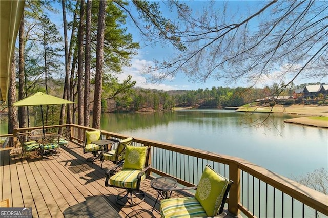 wooden deck featuring a water view
