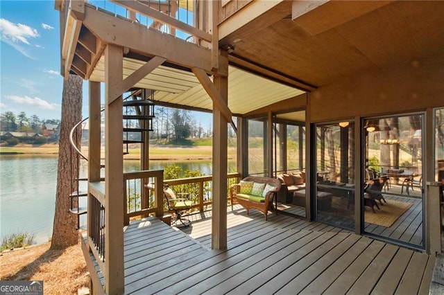 wooden deck with a water view