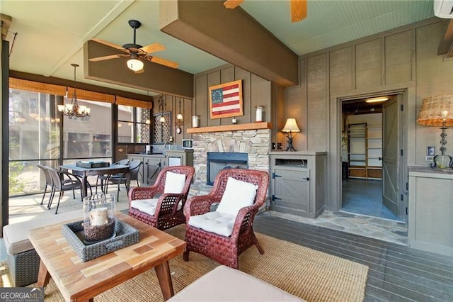 interior space with a ceiling fan and an outdoor hangout area