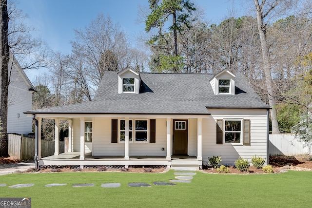 1861 Dyer Cir, Atlanta, GA 30341 - view of front of home with fence, covered porch, a shingled roof, and a front lawn