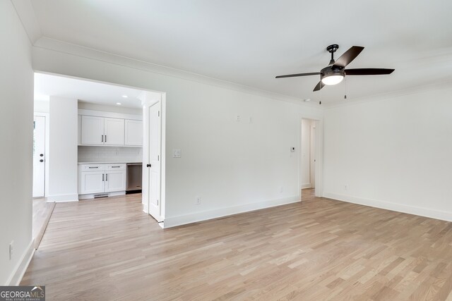 1861 Dyer Cir, Atlanta, GA 30341 - empty room featuring baseboards, ornamental molding, ceiling fan, and light wood-style flooring